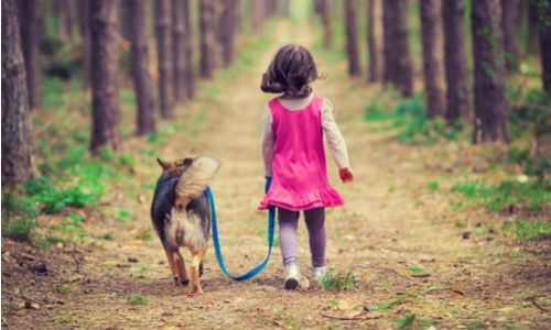 girl walking dog